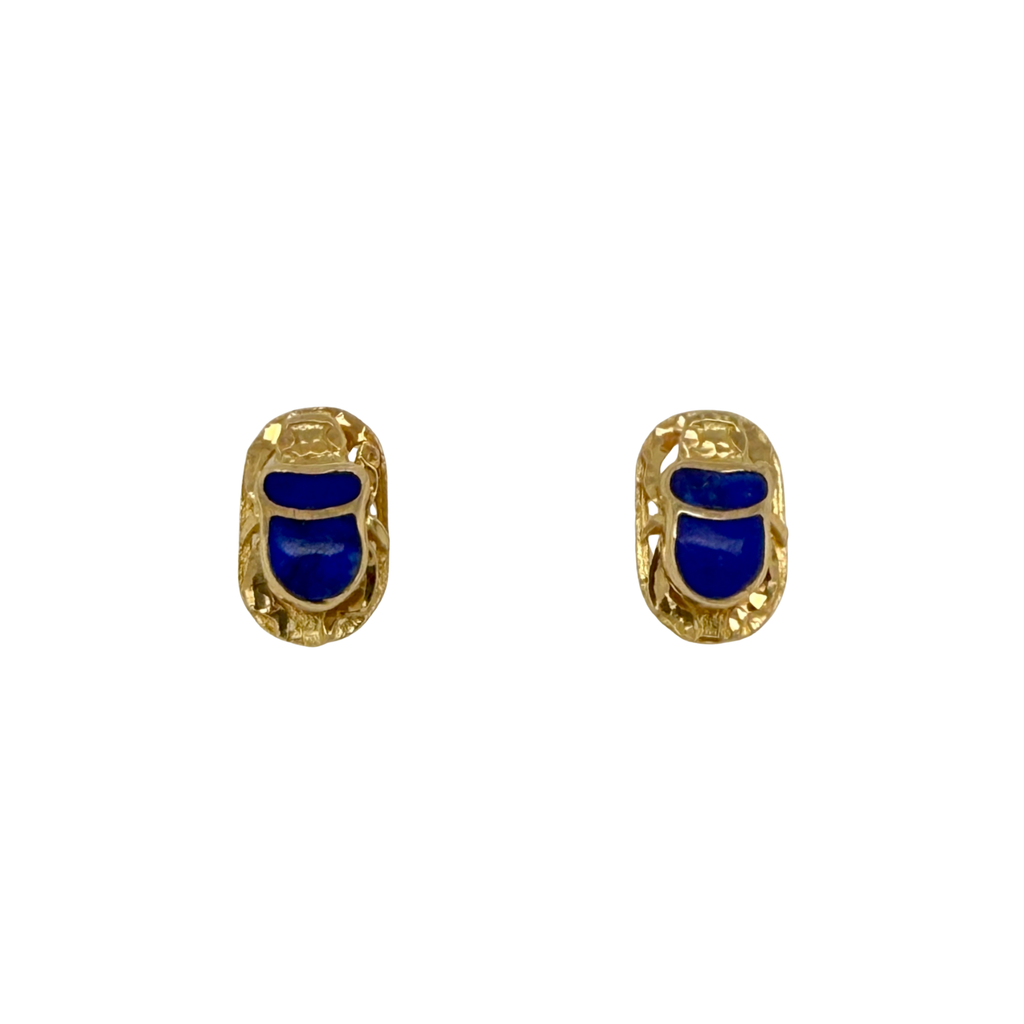 Pair of gold earrings with blue stones on a white background