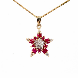 14K Gold Ruby and Diamond Star Pendant closeup of pendant on chain
