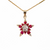 14K Gold Ruby and Diamond Star Pendant closeup of pendant on chain
