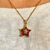 14K Gold Ruby and Diamond Star Pendant worn on model