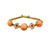 14K gold and coral bracelet featuring alternating filigree medallions and braided chain details