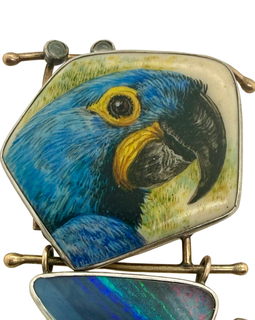 closeup of Ali Wieboldt 14K Gold & Sterling Painted Parrot Pin Opal & Moonstones