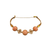 Antique coral and gold bracelet with sculpted filigree medallions and bead‑decorated fittings