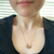 Art Nouveau Repurposed 14K Gold Seed Pearl Crescent Necklace on model
