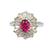 Close-up of faceted ruby center stone with diamond baguette halo