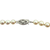Close-up of the oval 14K white gold filigree clasp with floral openwork