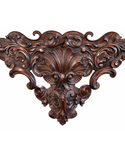Close‑up of the George III console table’s carved mahogany apron showing scrolling acanthus leaves and central shell motif, circa 1770.