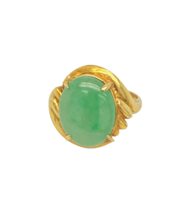 Close-up of the four prongs holding the domed apple green jade cabochon