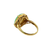 Side profile of a gold jade ring showing the sculptural curved shoulders