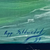 Large framed seascape painting with lighthouse background