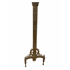 Decorative andiron with intricate designs on a white background