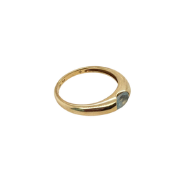 Side profile of the gold aquamarine ring showing the gently tapered polished band