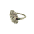 Side view of the platinum ring showing sweeping curves and polished platinum shoulders