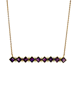 Close‑up of square‑cut amethysts set in gold bezels with alternating seed pearls.