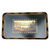Hand‑painted landscape scene on a vintage tray, showing hills, water, and trees with a gold decorative border.