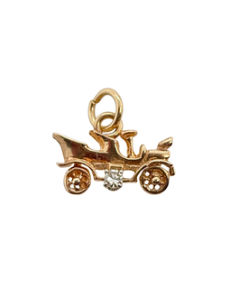 Vintage 14K gold antique car charm with diamond accent, side view