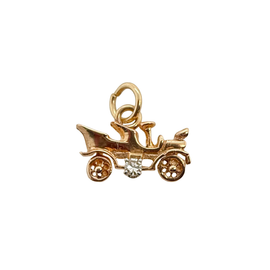 Vintage 14K gold antique car charm with diamond accent, side view