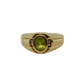 Vintage 14K gold men's peridot and diamond ring circa 1950, top view showing faceted green stone