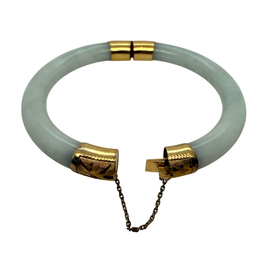 Vintage Chinese jadeite bangle bracelet shown open with engraved 14K gold clasp and safety chain