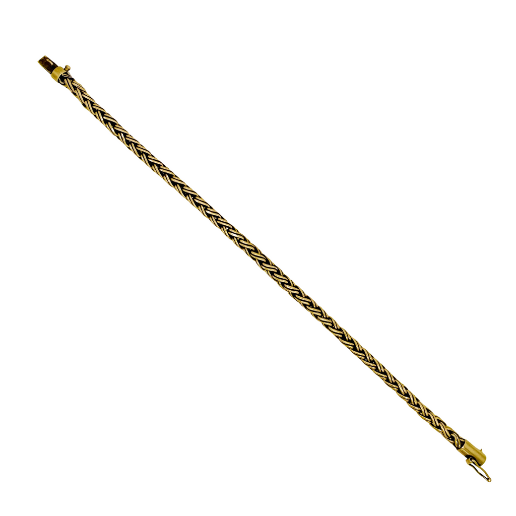 Vintage Tiffany & Co. 14K yellow gold wheat-link bracelet laid out in full on a white background
