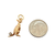 Vintage gold kangaroo charm shown with a dime for scale