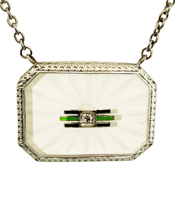 Art Deco white gold pendant necklace with carved rock crystal, central diamond, and green and black enamel accents.