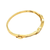 edge view of a vintage 14K yellow gold bangle bracelet with channel-set baguette diamonds in an undulating ribbon design