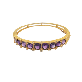 Antique 14K gold amethyst bangle showing prong‑set purple gemstones and safety chain