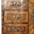 Eighteenth Century German Baroque walnut desk with a central blind cupboard, flanked by small drawers, featuring highly figured walnut facings, closeup on drawer